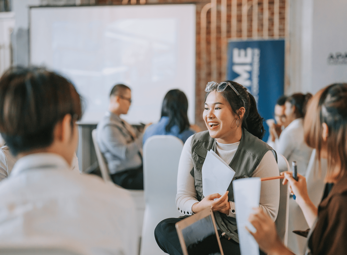 Woman Smiling in an Event Room