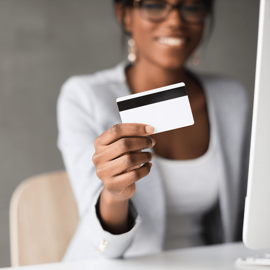 Woman Holding Up a Swipeable Card
