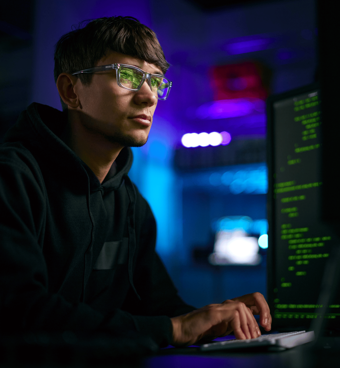 Man in a Dark Room Writing Code