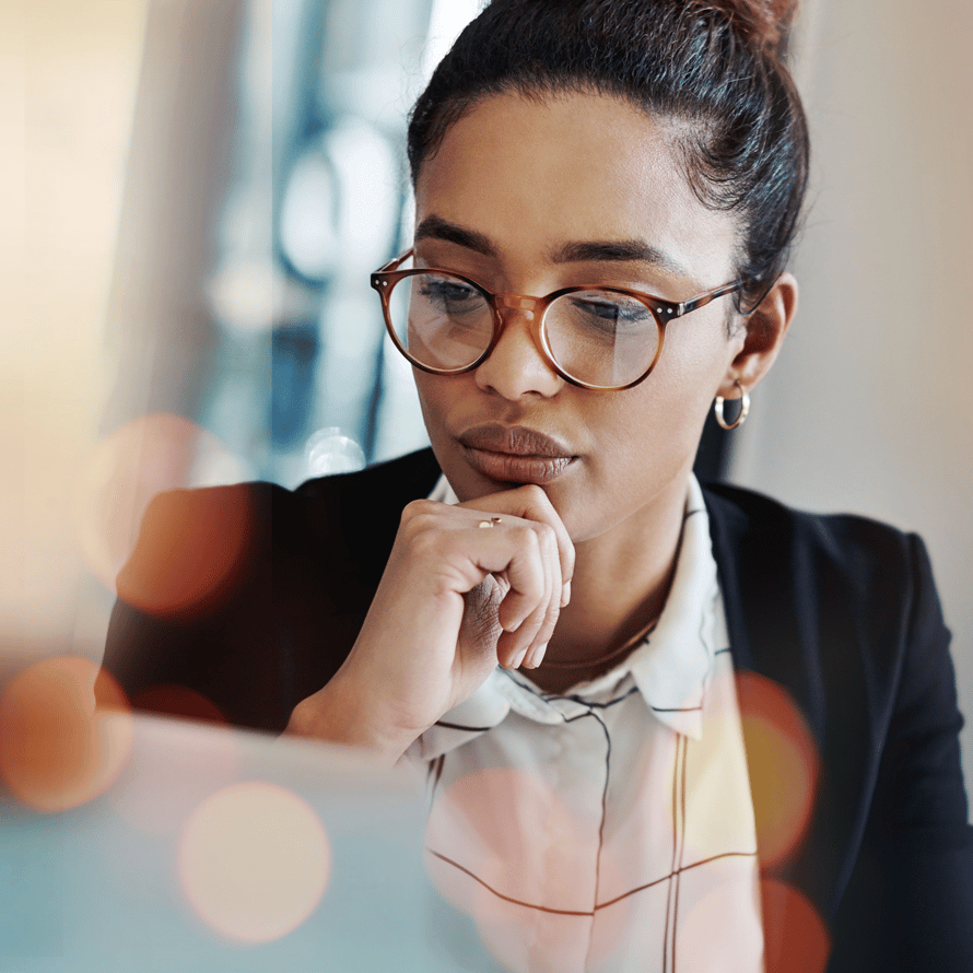 Thoughtful Woman Reading and Touching Chin