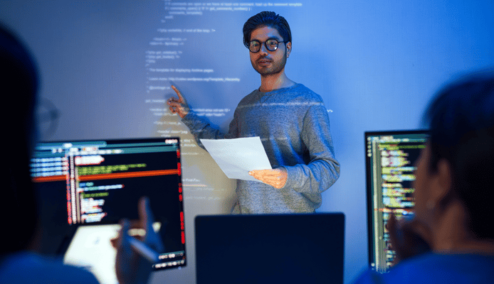 Person Pointing at Text on Smartboard Projector Running Across Body and Face