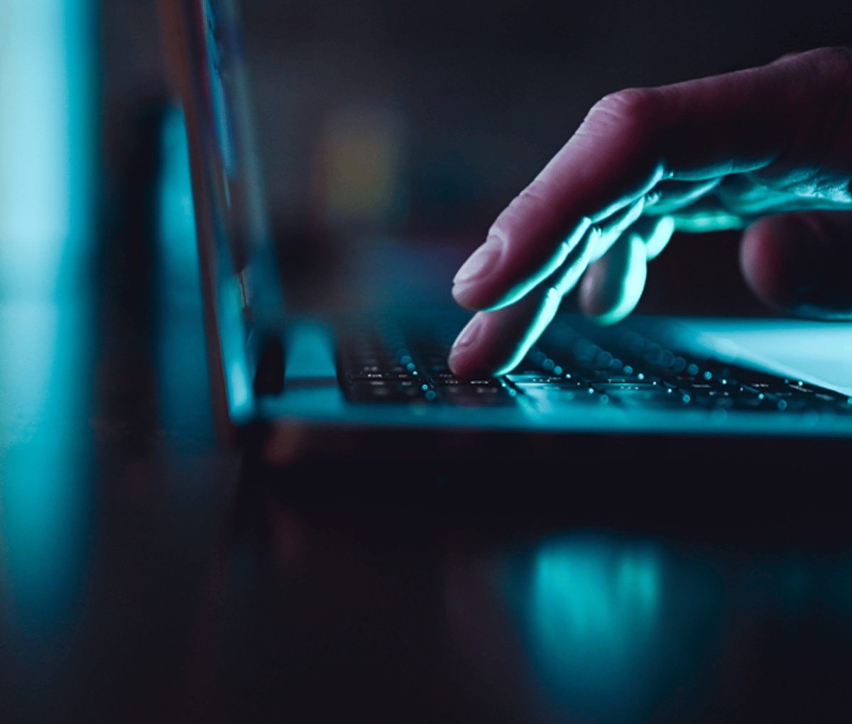 Person typing on keyboard