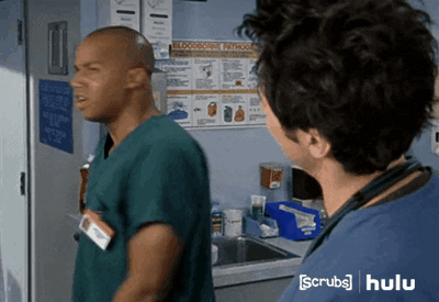 Turk from Scrubs giving a high five to JD.