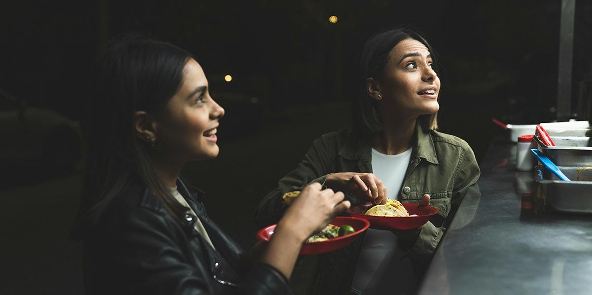 Friends enjoying the flavors of Latin American food.