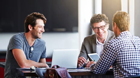 Group of professionals smiling during an online Farsi language class