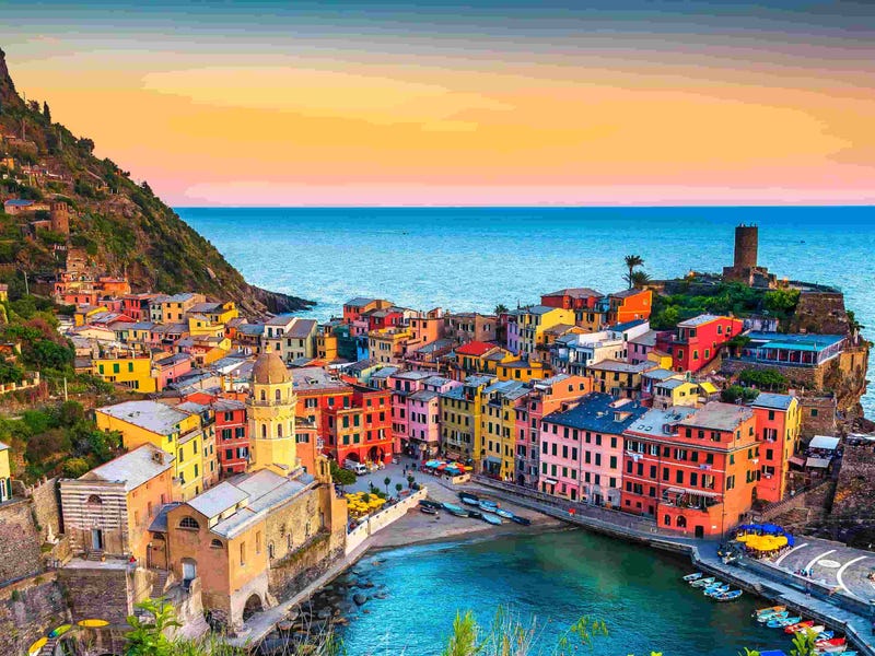 Scenic view of Vernazza, Italy at sunset—highlighting the immersive cultural backdrop that makes learning Italian online with Berlitz a rich and engaging experience.