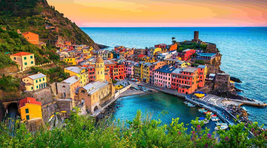 Scenic view of Vernazza, Italy at sunset—highlighting the immersive cultural backdrop that makes learning Italian online with Berlitz a rich and engaging experience.
