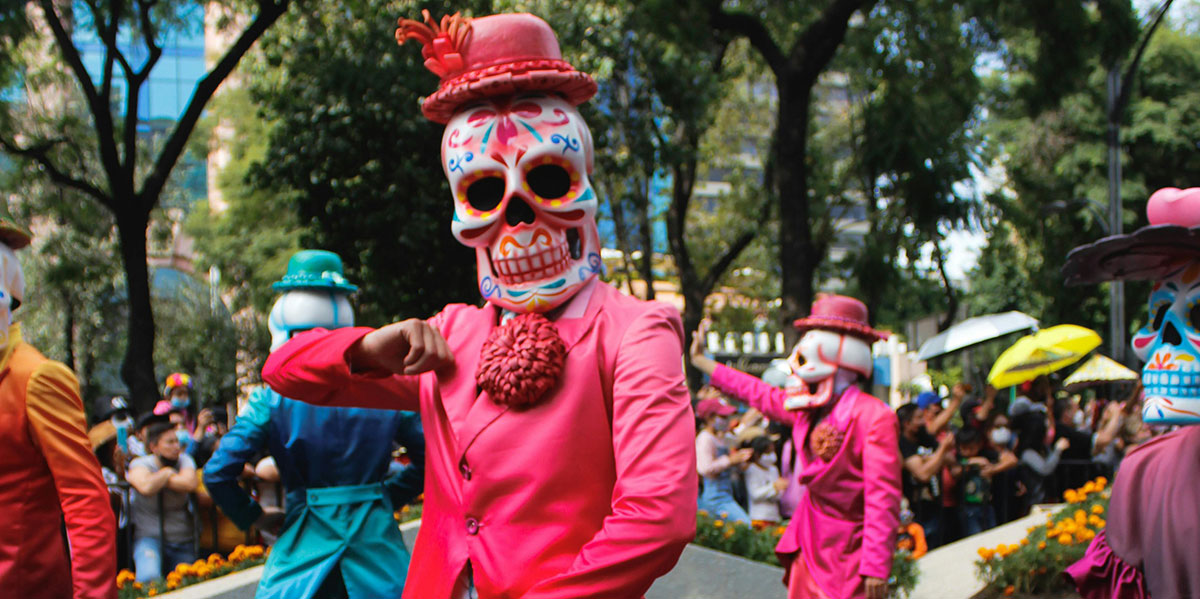 Mexican holidays and festivals example: Day of the dead parade in Mexico.