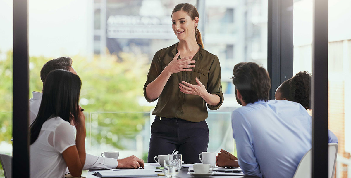 Woman speaking Spanish in a business environment to help better connect with her colleagues.