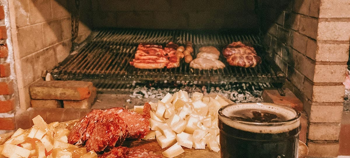 Asado is a traditional Argentine barbecue featuring many cuts of meats, grilled over an open fire.