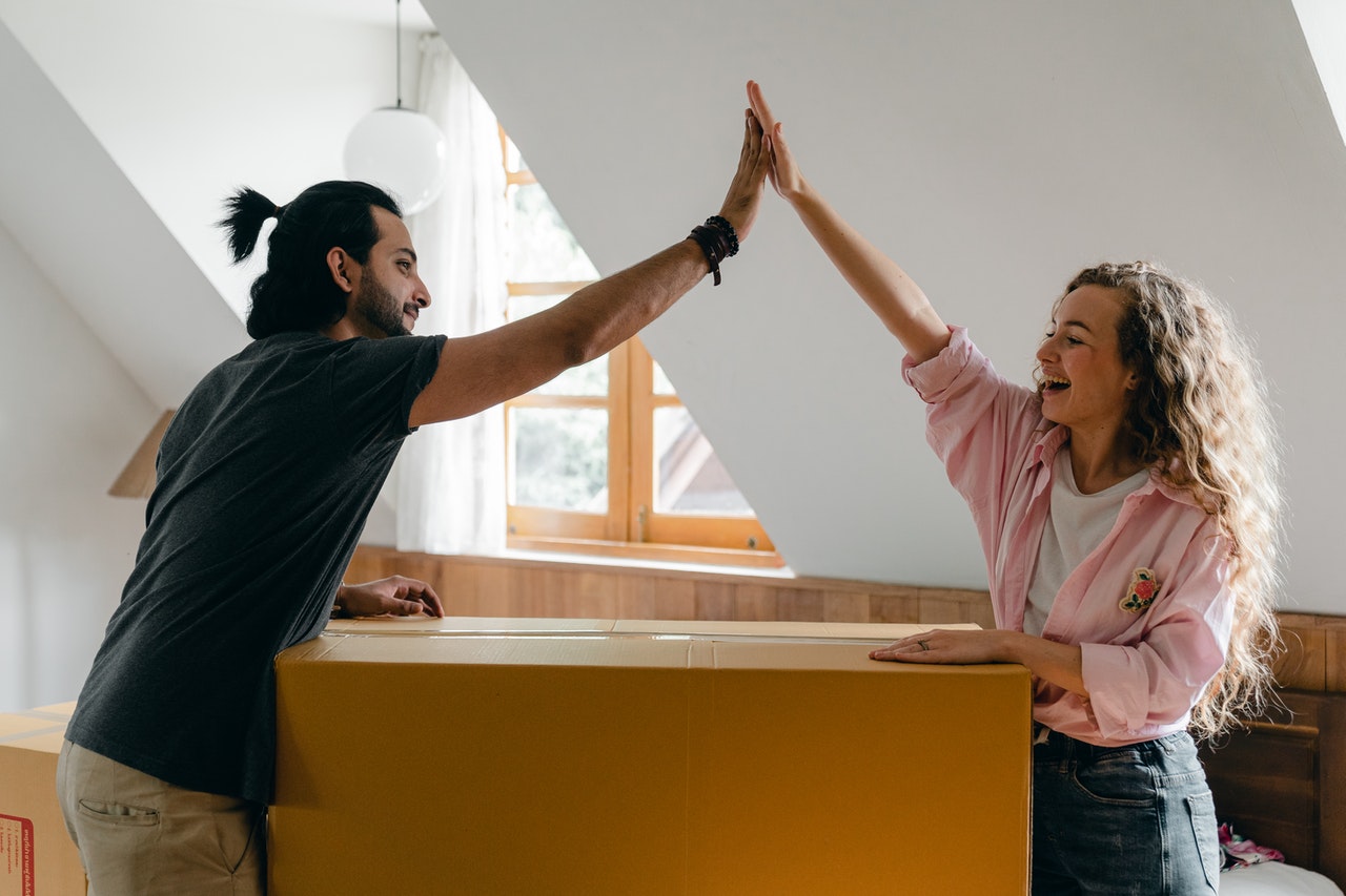 Two people relocating to Germany learning ways to say hello in German.