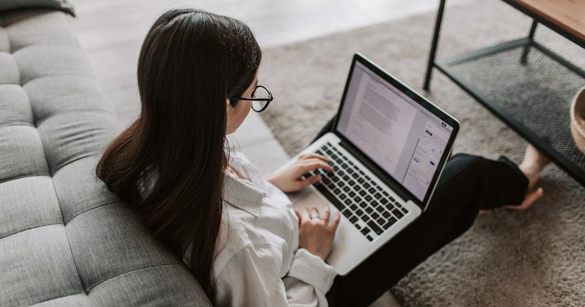 Woman studying gender agreement between nouns and adjectives in French.