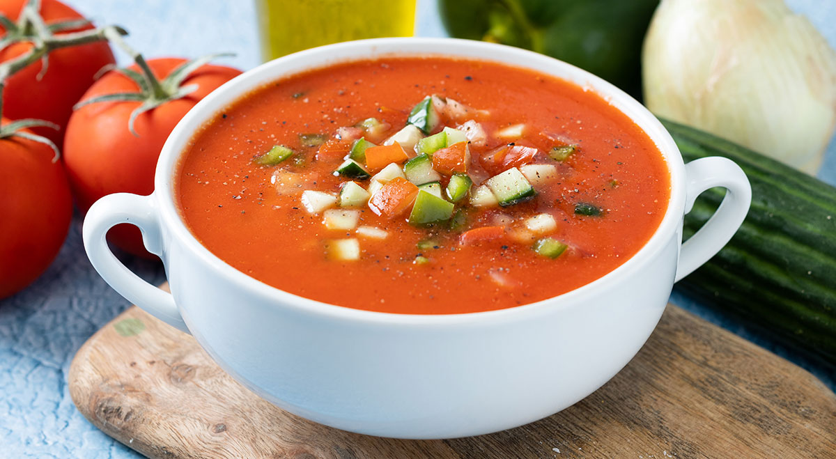 Gazpacho is a cold soup made with tomato, bread, cucumber, onion, garlic, green pepper, and olive oil.