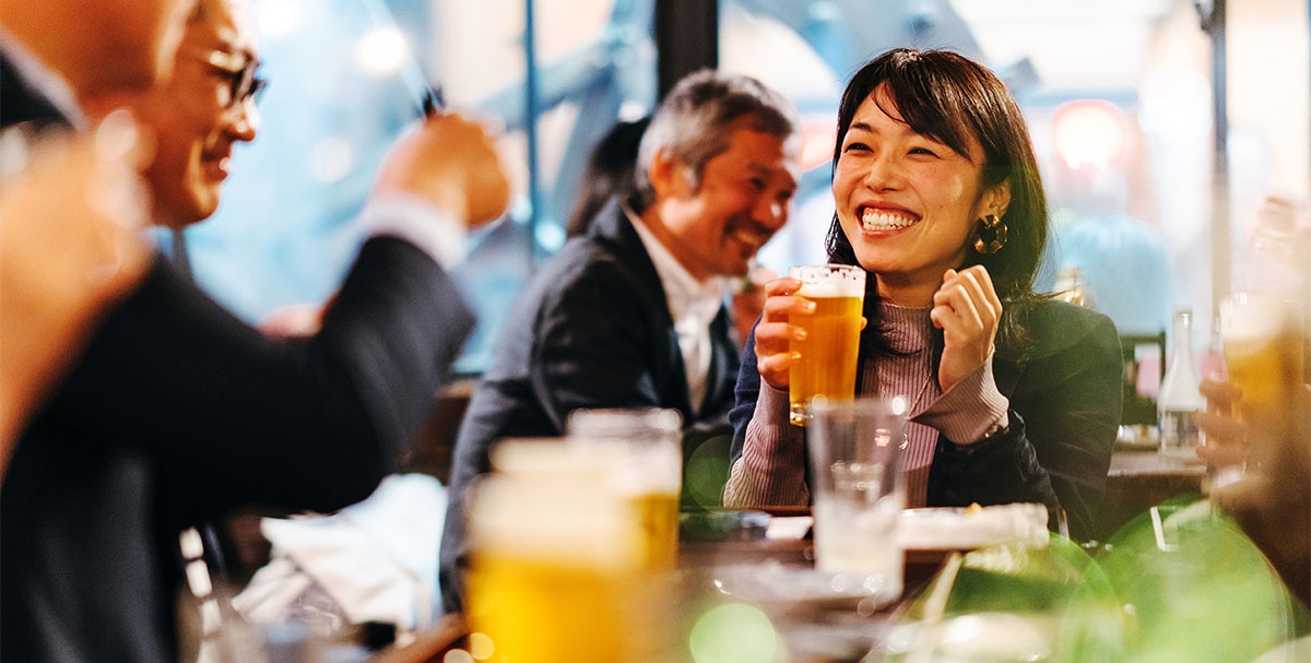 Work colleagues having a beer after work.