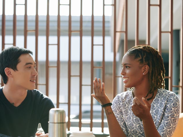 Two students practicing conversation at a Berlitz language school, engaging in an immersive speaking session in a relaxed setting.