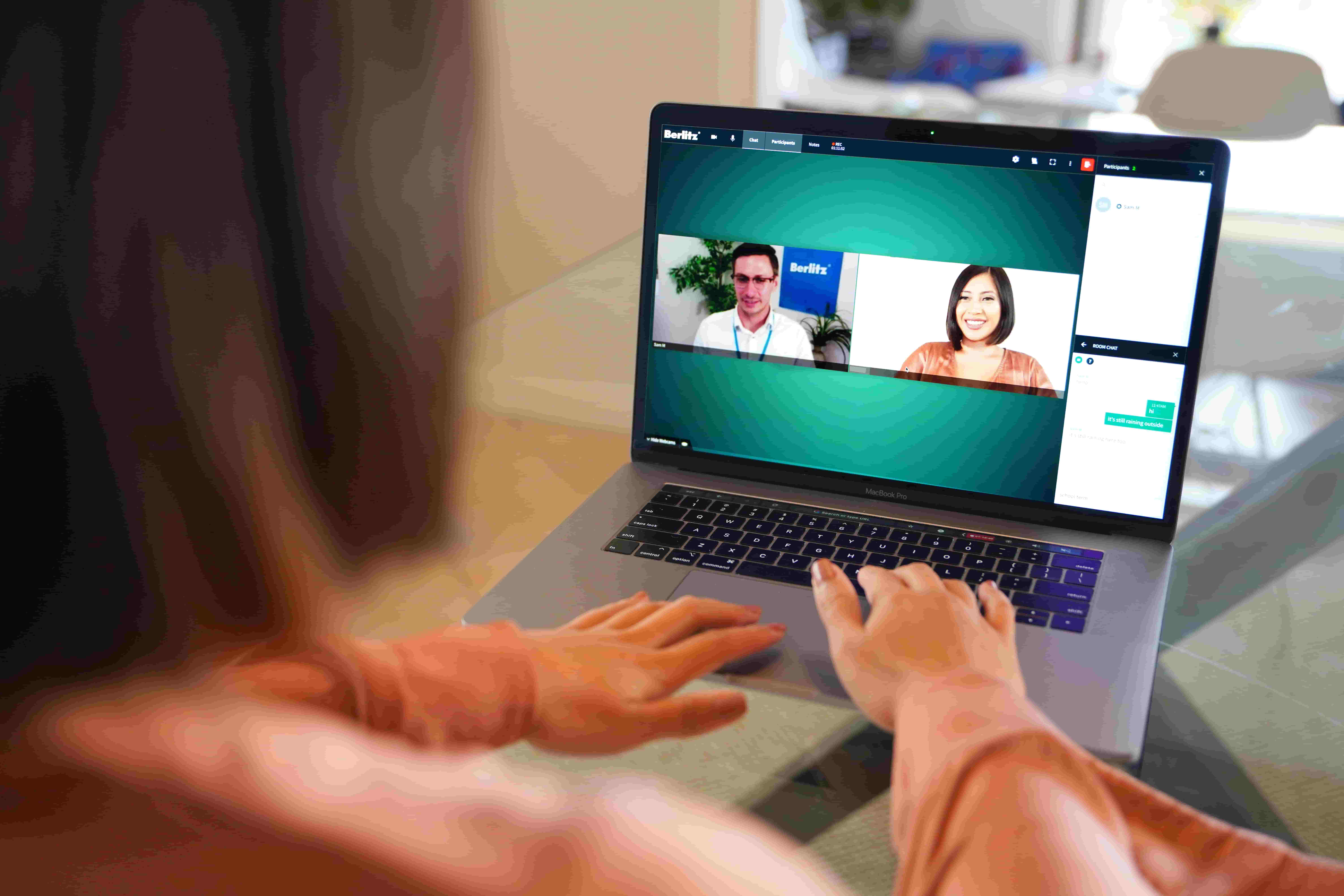 Student attending a Berlitz virtual language class from home, showcasing the convenience of flexible online courses with live instructors.

