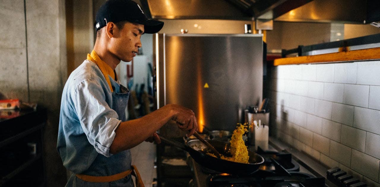 Man cooking fried rice in China.