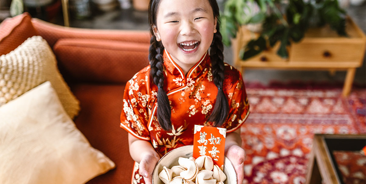 Young girl wearing red, as it is the most important color for the Chinese New Year.