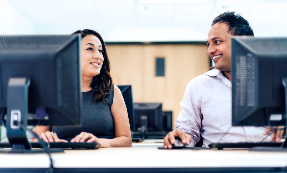 Students engaged in an online Farsi language class, learning and practicing with computers