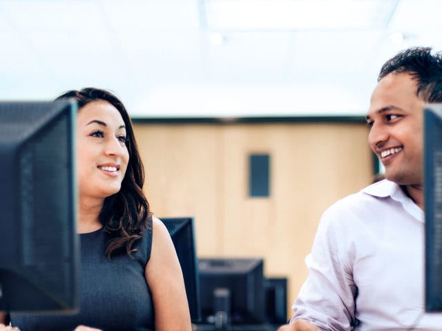Students engaged in an online Farsi language class, learning and practicing with computers