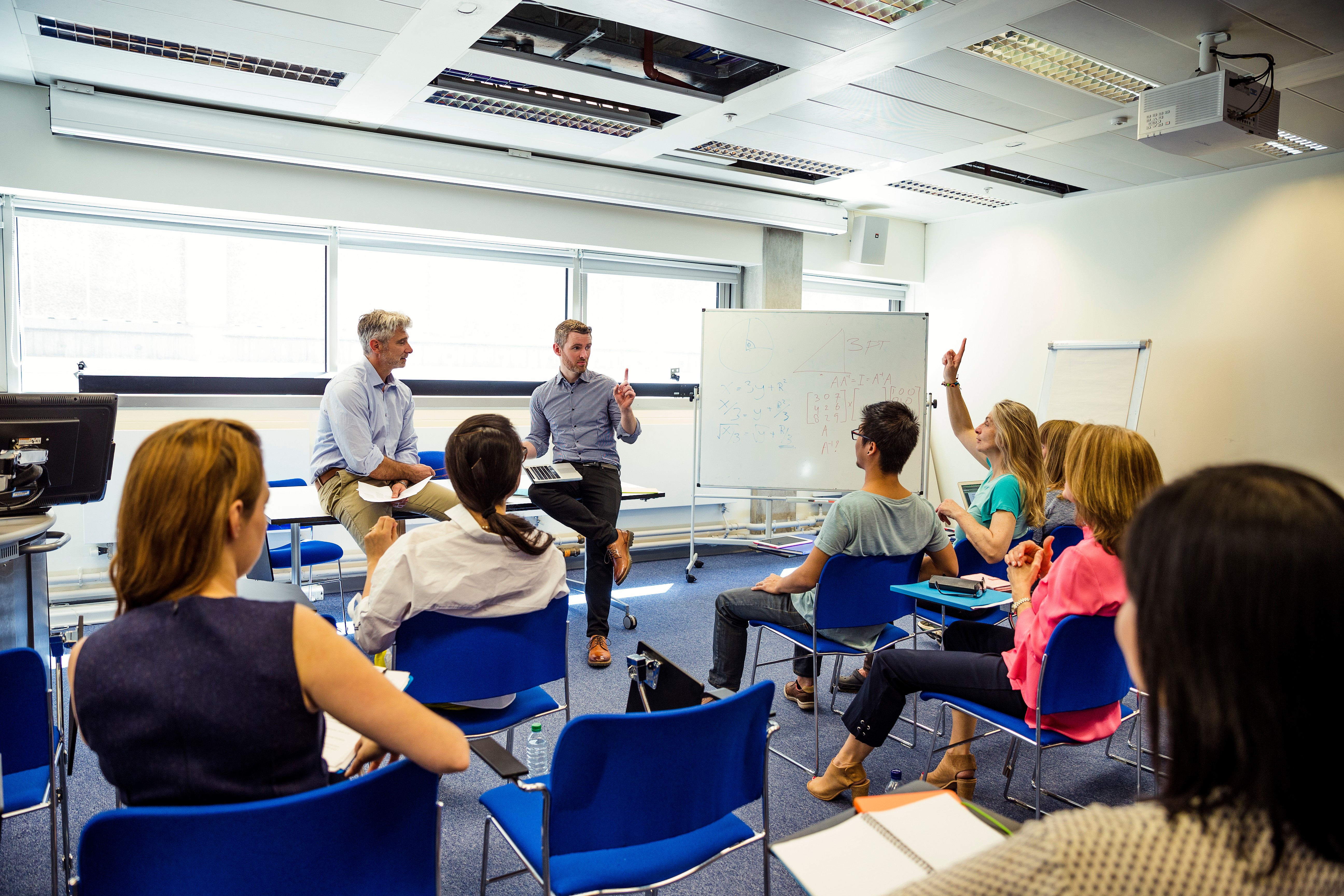 Students learning English in Berlitz classroom