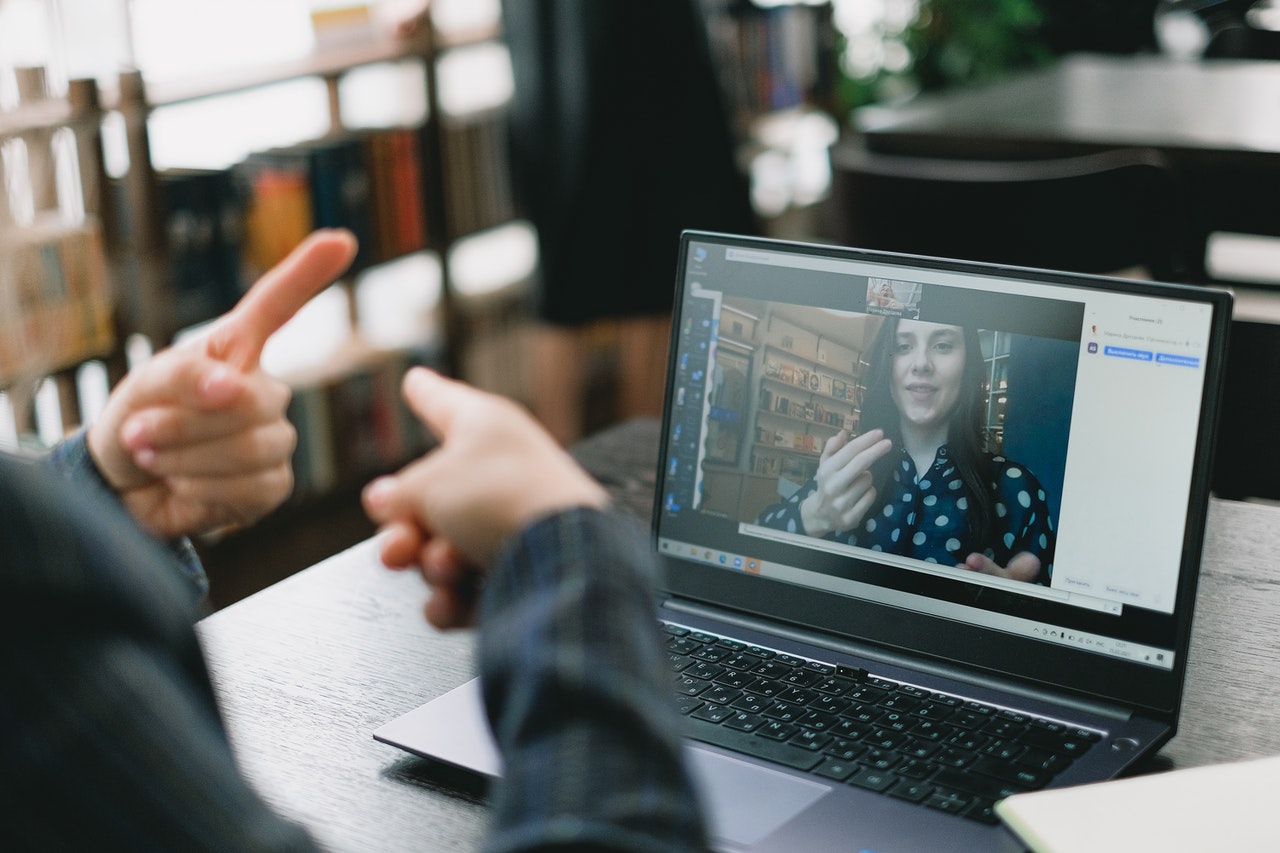 Woman learning ASL online.