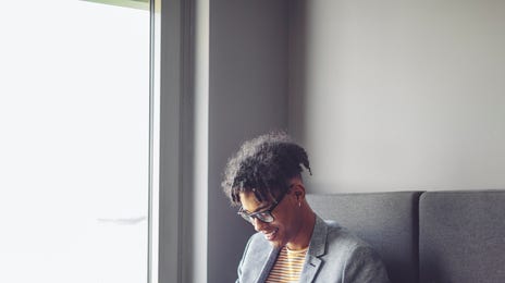 Man learning English online through private classes while relaxing at home