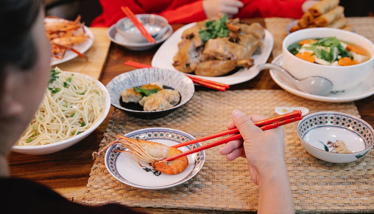 Traditional Chinese New Year foods such as dumplings and spring rolls.