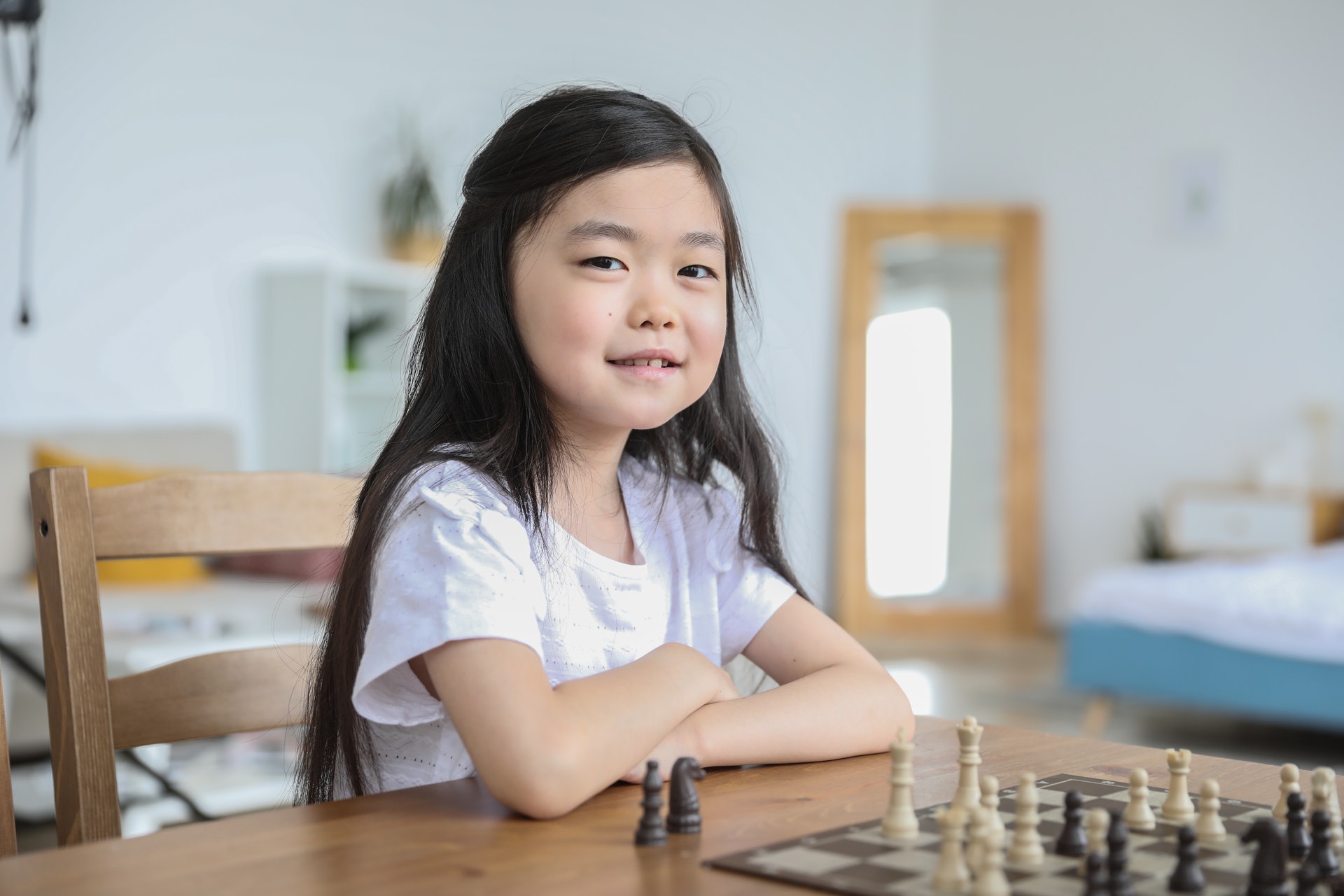 Young_child_memorizing_chess_checkers_techniques_and_tricks.jpg