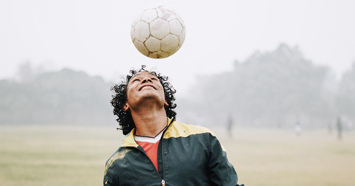 Man playing football.