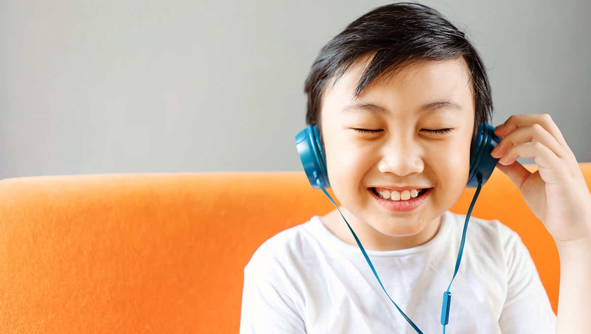 Young boy learning a language online.