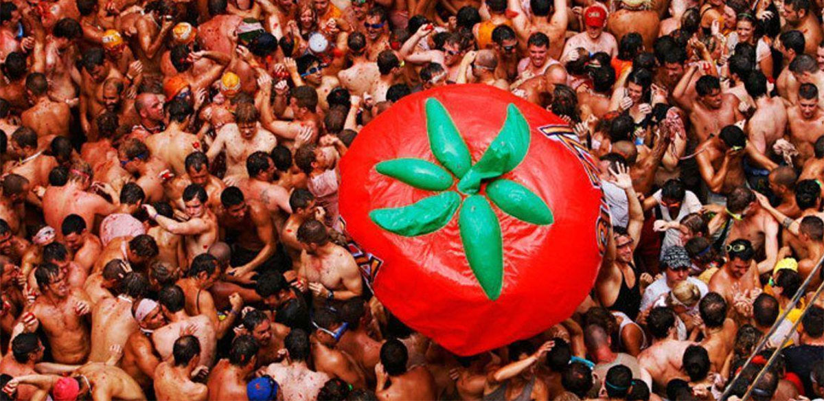 La Tomatina festival is where thousands gather for a massive tomato fight.