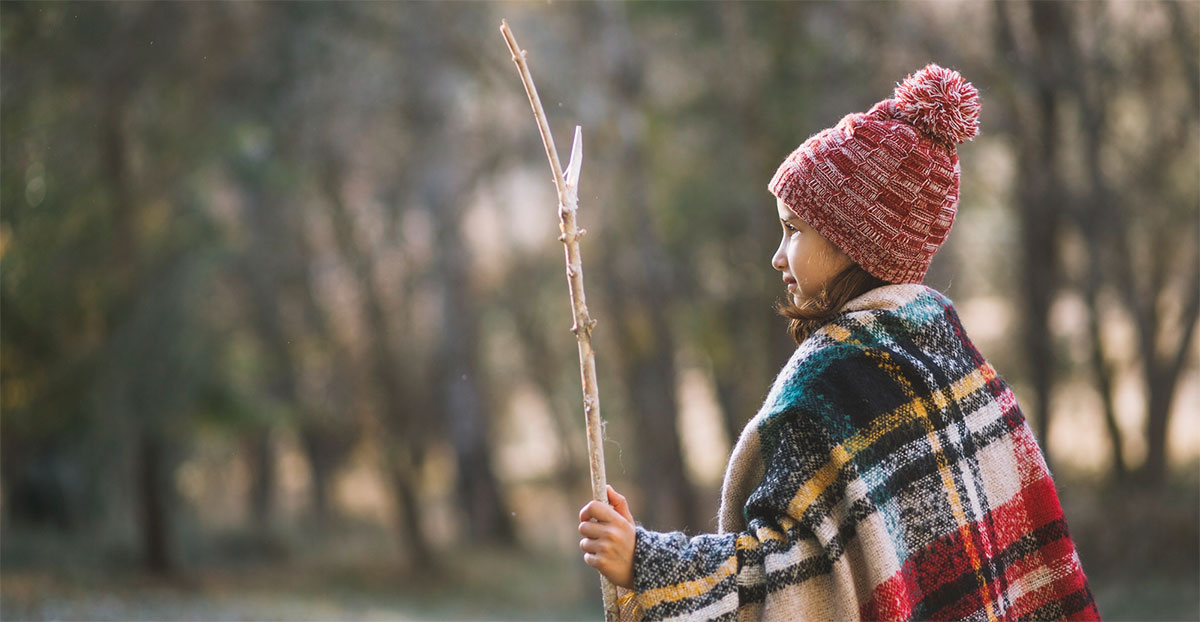 Young girl reflecting on the history of Thanksgiving.