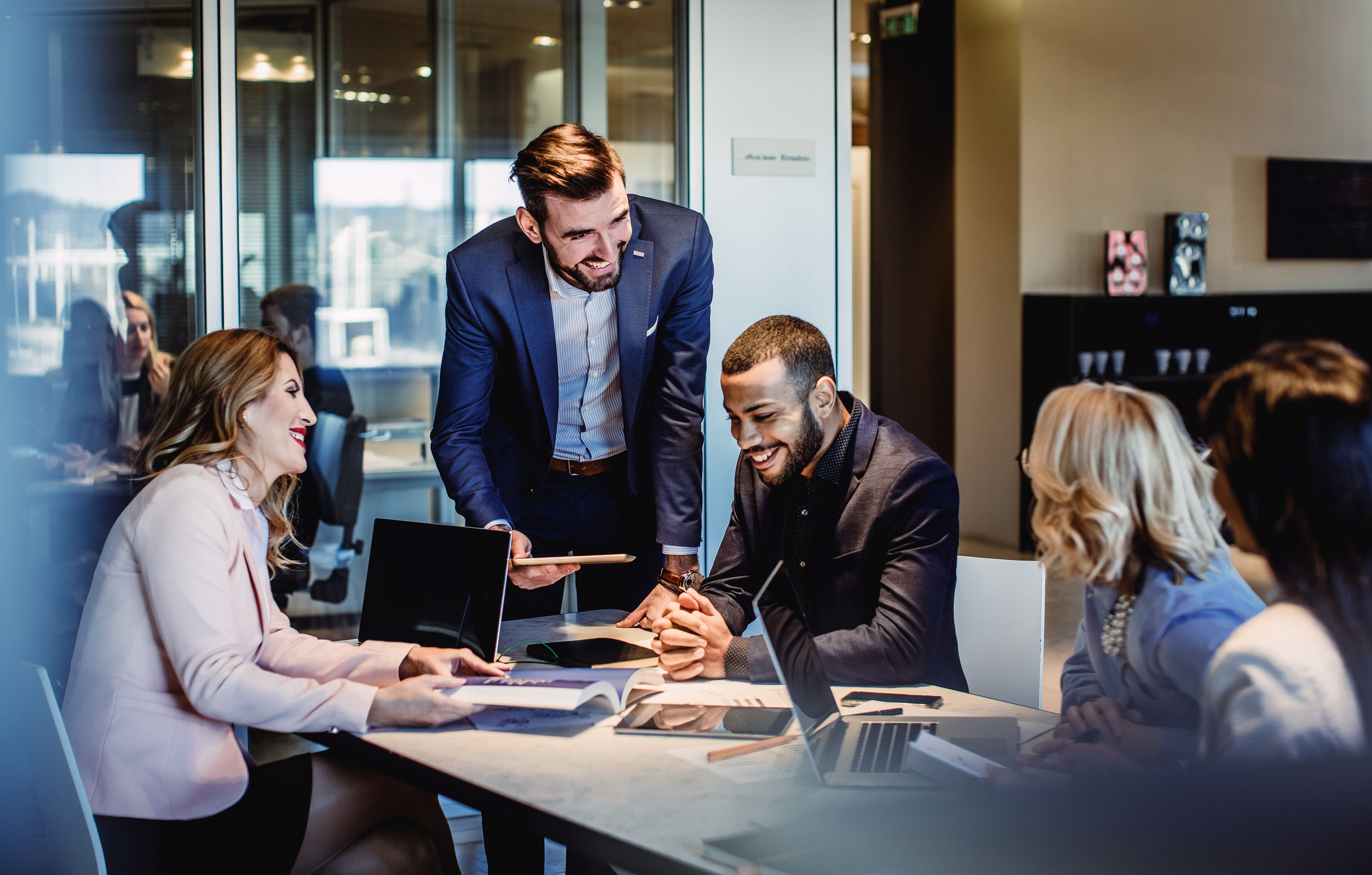 Diverse professionals engaged in a collaborative meeting during a corporate culture training session
