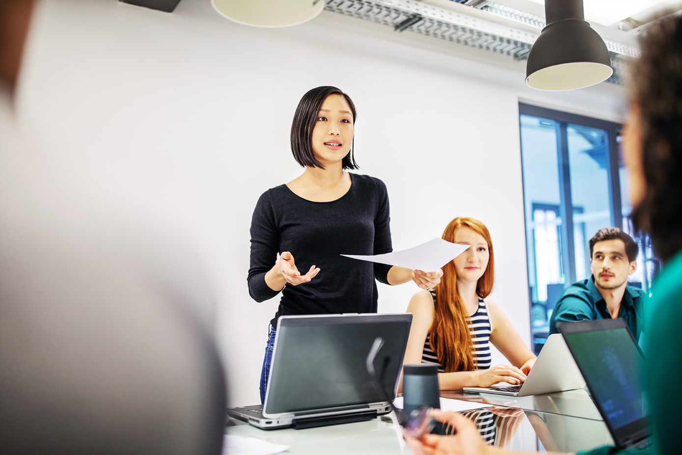 Woman explaining inclusive language terms and vocabulary guide in the workplace for DEI