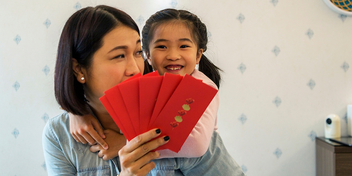 Mother and daughter preparing to celebrate the Chinese New Year.