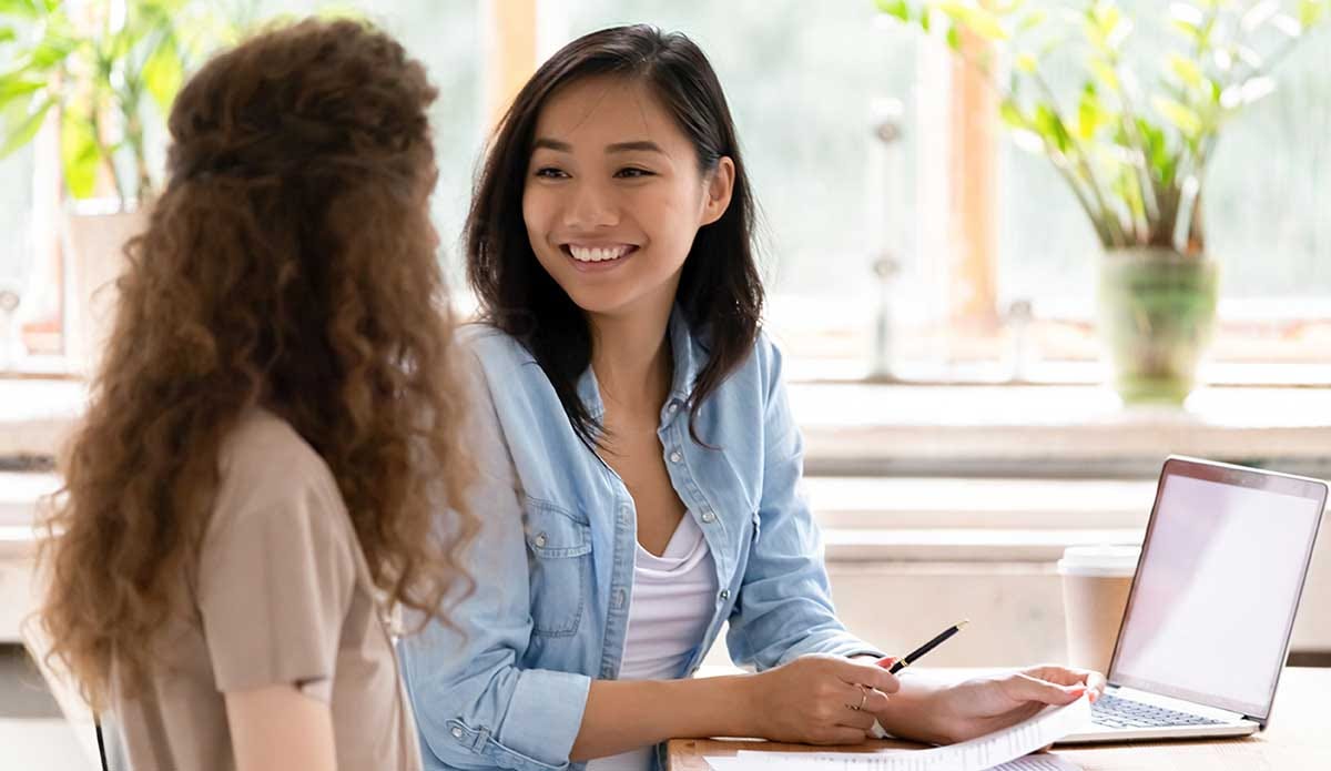 Woman learning how to use adjectives in Chinese.