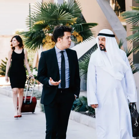 Government employee conversing with international representative