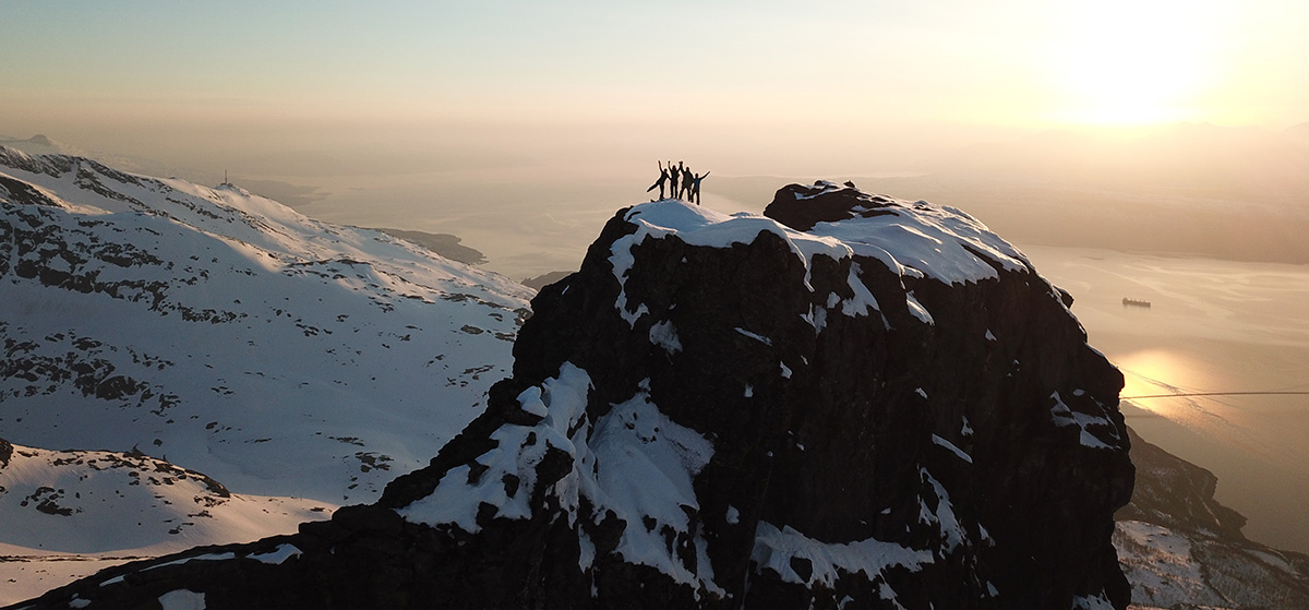 Hikers reach the summit in Italian.