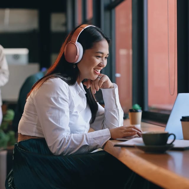 Female learning a language on her laptop