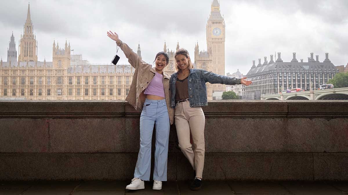 Two tourists posing for a photo in London.