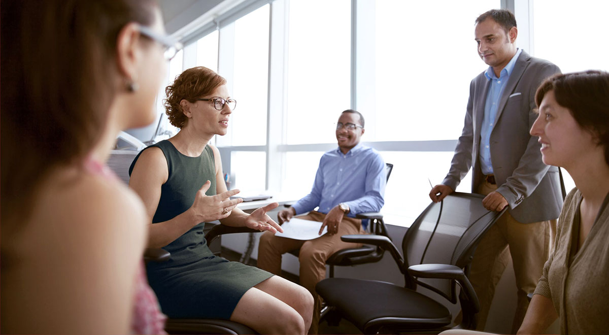 Business team discuss potential sales and marketing strategies.