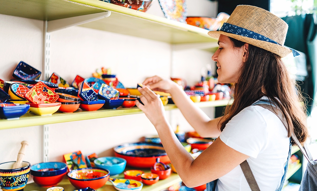 Woman shops for souvenirs.