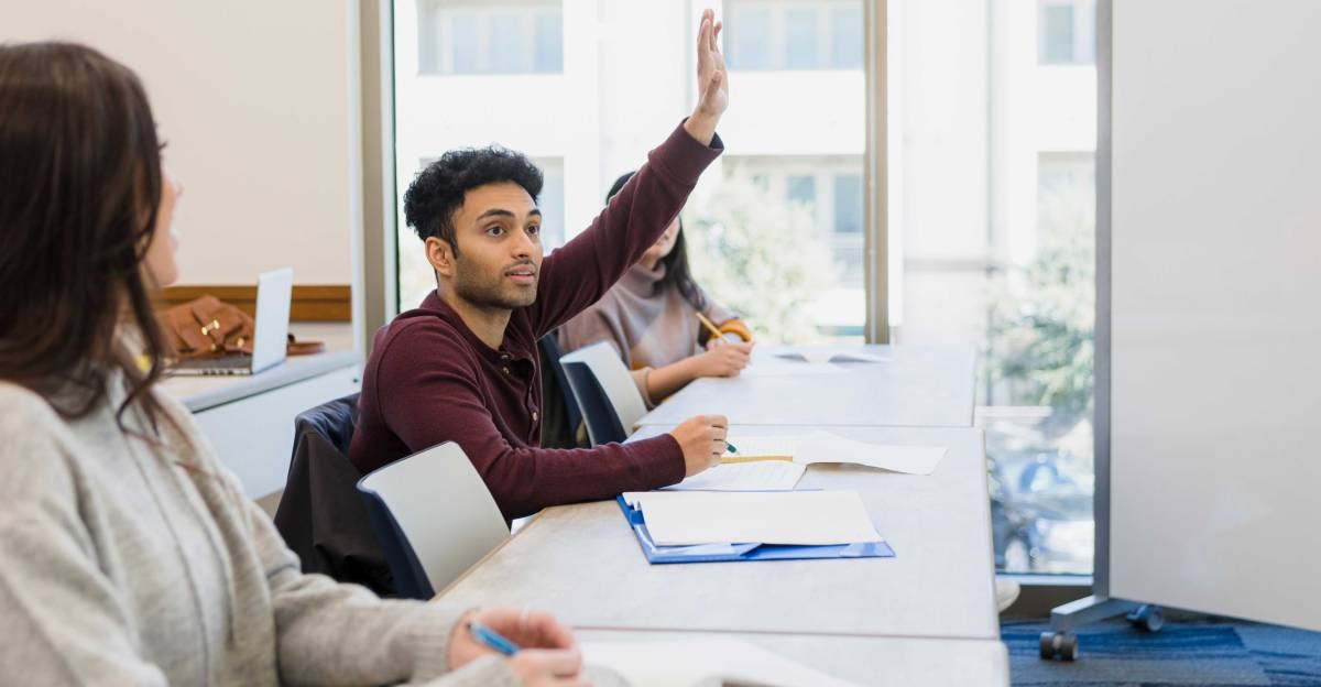 Man asks question during his Berlitz French class.