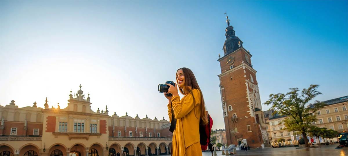 Woman taking photos of Krakow.