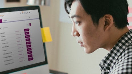 Man attending an english group class online through the Berlitz CyberTeachers platform at home.