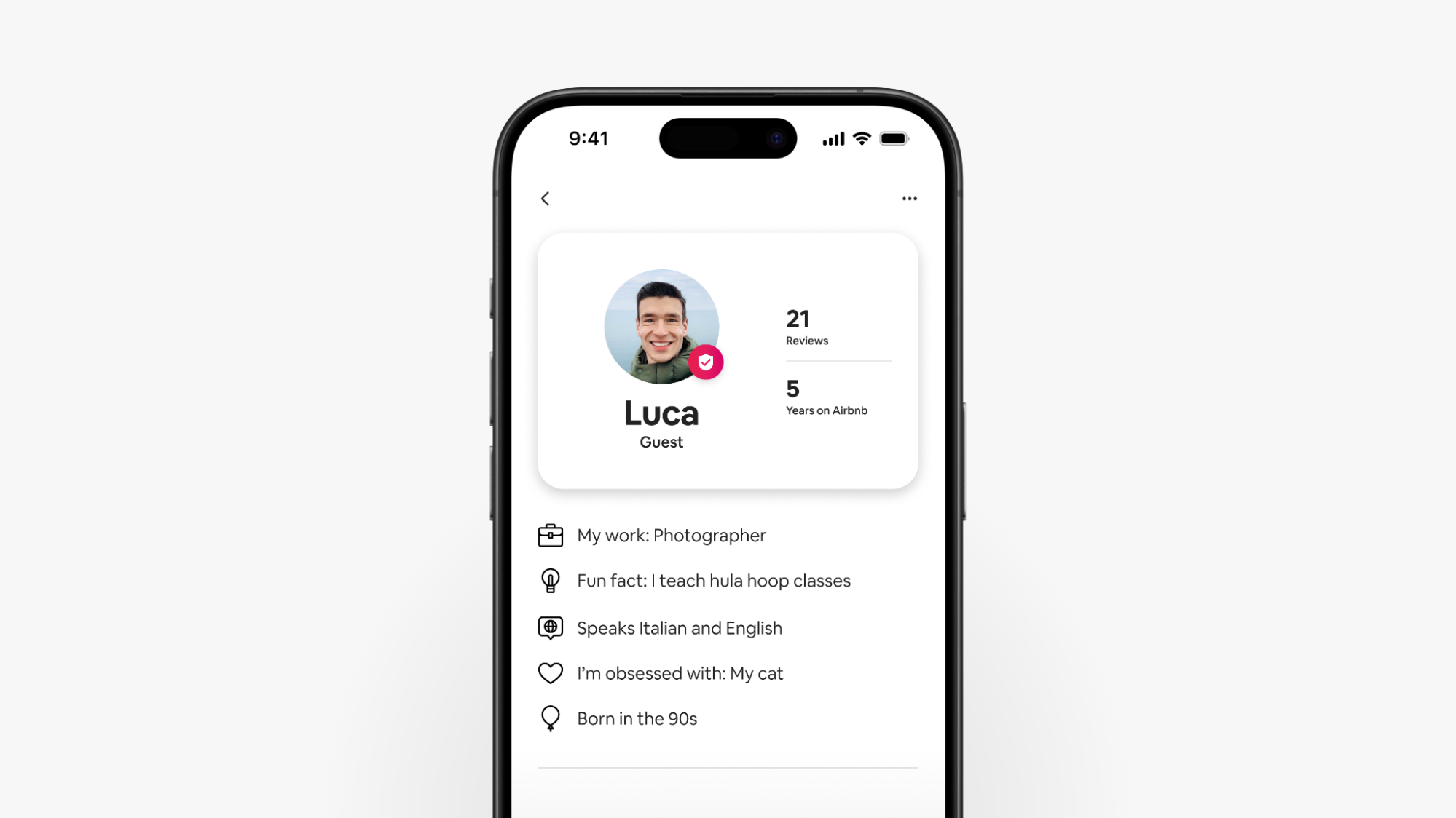A screenshot of a smartphone displays Luca’s upgraded Airbnb guest profile, which shows reviews and details about the guest. 