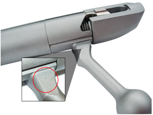 A punch dot on the handle of the bolt