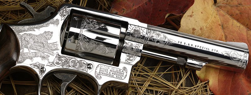 Revolver displaying a cheetah in a tree using Bulino and traditional engraving