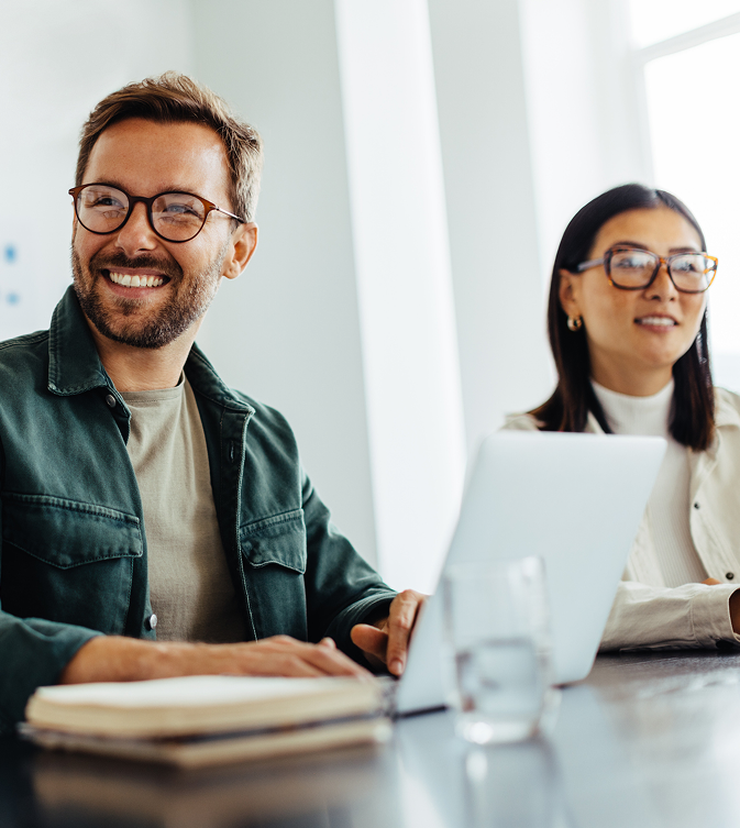 Man smiling at work desk